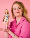 Model & Influencer Enya from the Netherlands holds Barbie's first doll with Down's syndrome