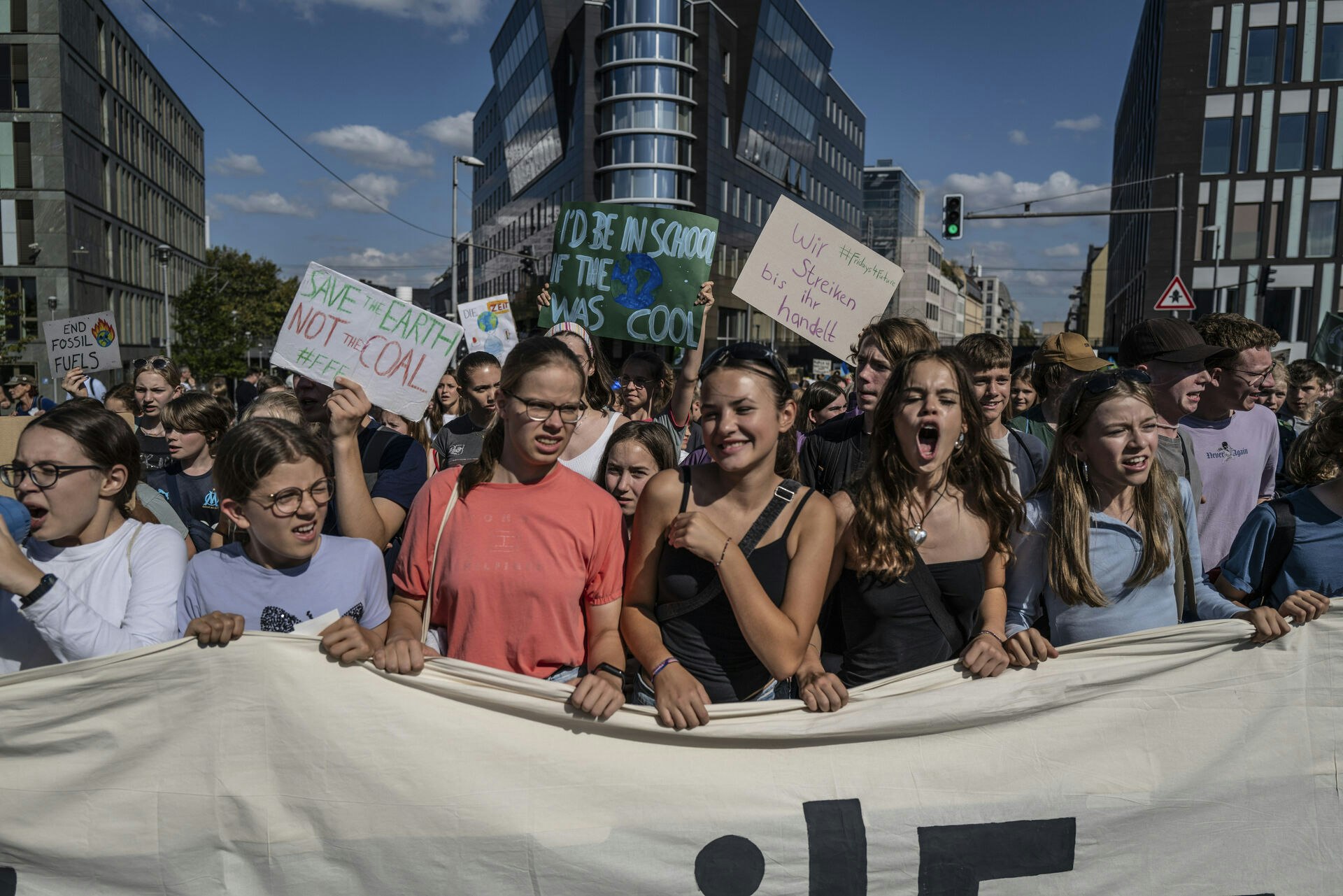 September 15, 2023 - Berlin, Germany: Young demonstrators shout slogans during a Fridays for Future climate strike under the motto #EndFossilFuels (Hermann Bredehorst / POLARIS)