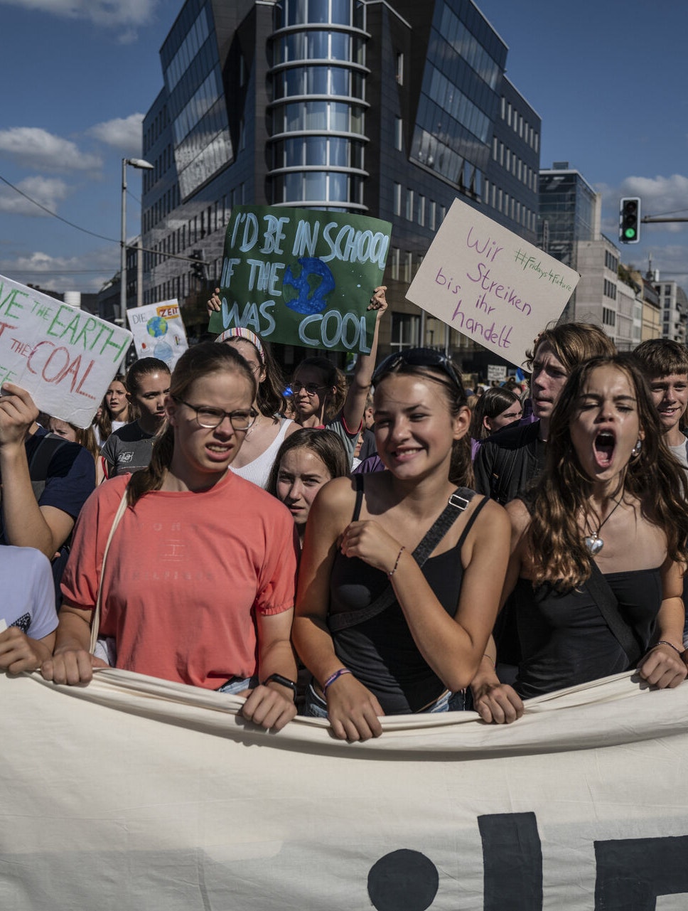 September 15, 2023 - Berlin, Germany: Young demonstrators shout slogans during a Fridays for Future climate strike under the motto #EndFossilFuels (Hermann Bredehorst / POLARIS)